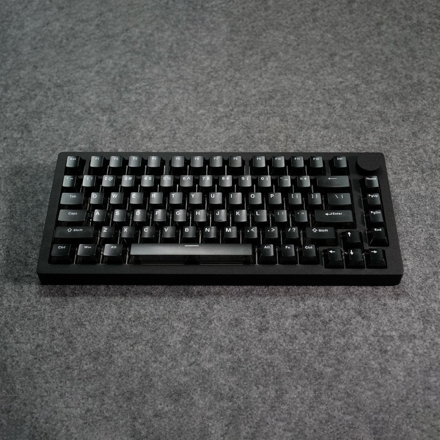Black MonsGeek M1 V5 HE Magnetic Keyboard on a gray surface