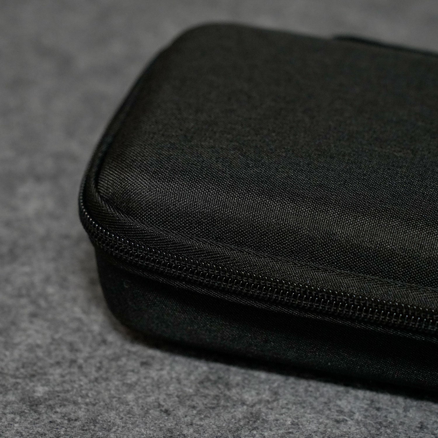 Black MonsGeek Keyboard Carrying Case on a gray textured surface