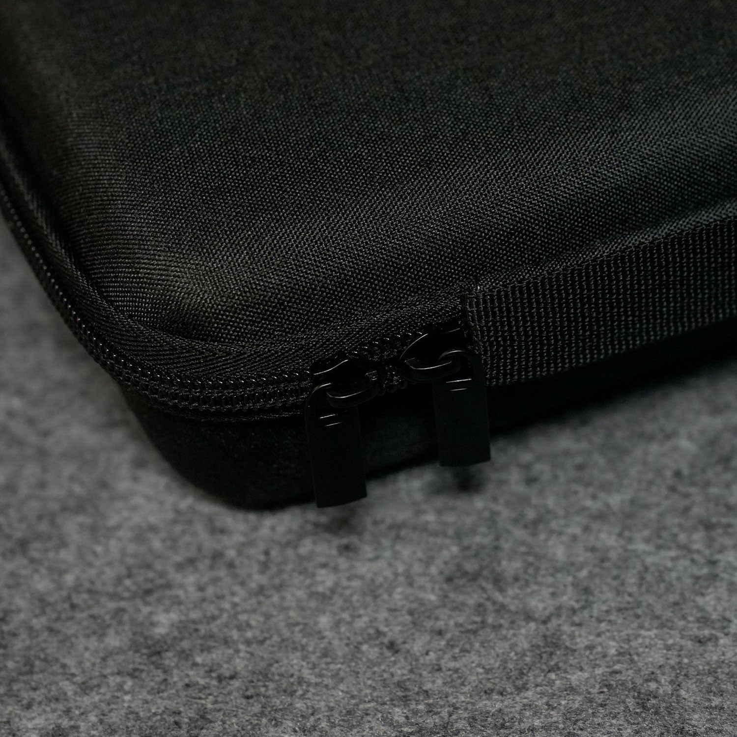 Close-up of a MonsGeek Keyboard Carrying Case on a gray surface